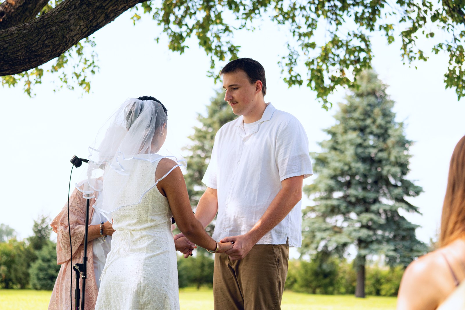 Outdoor Iowa wedding ceremony under the trees
