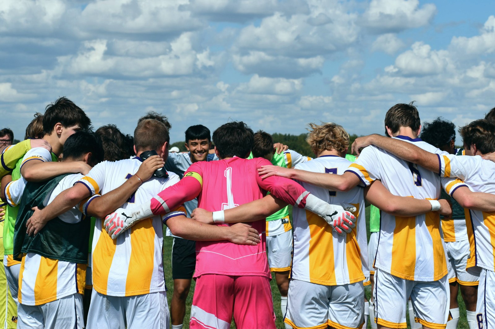 Soccer team huddle sports coverage